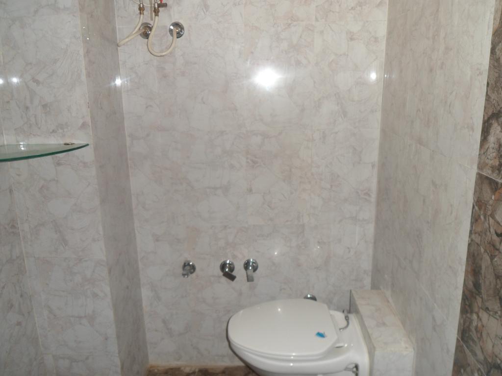 Hotel Canada Palace Watuwa Стая снимка